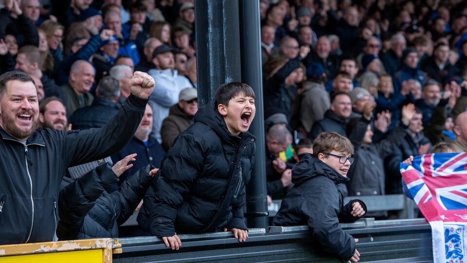 Young fan celebrating goal in Thatchers End